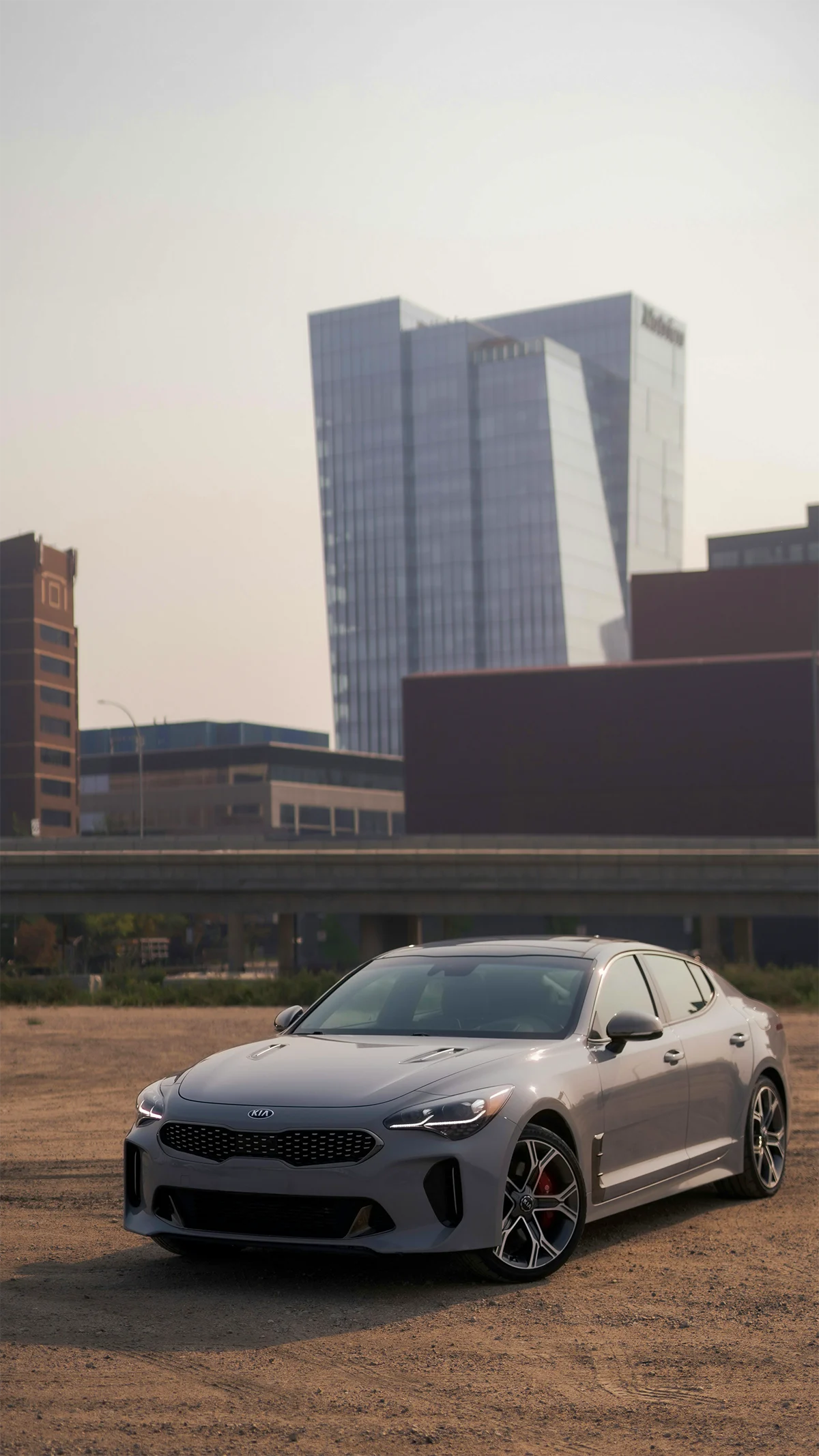 Kia Stinger sport sedan parked in urban setting