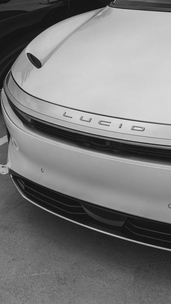 Front detail of Lucid Air electric luxury sedan showing Lucid badge and lighting design