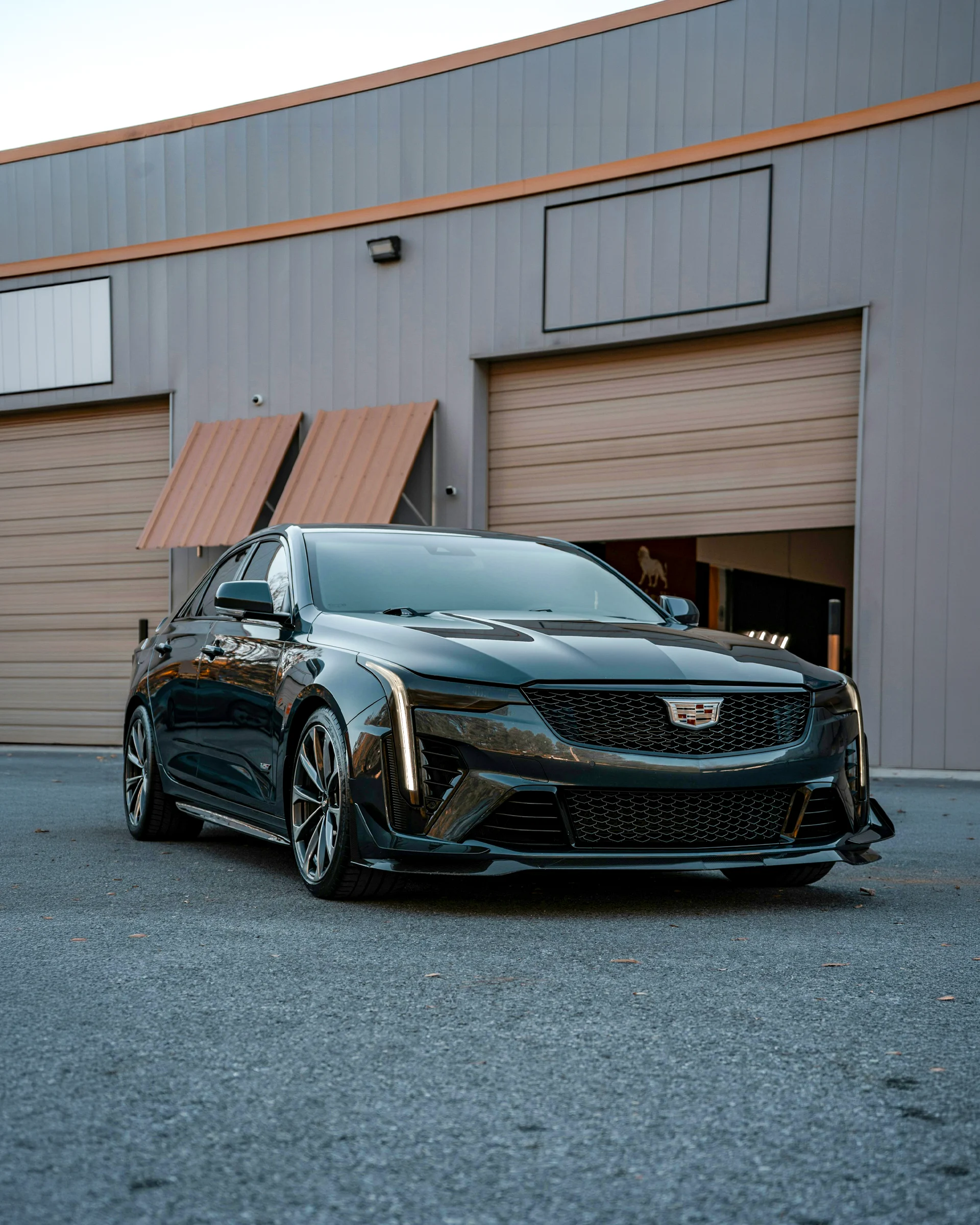 Cadillac CT5 sedan parked outside a building showing front three-quarter view