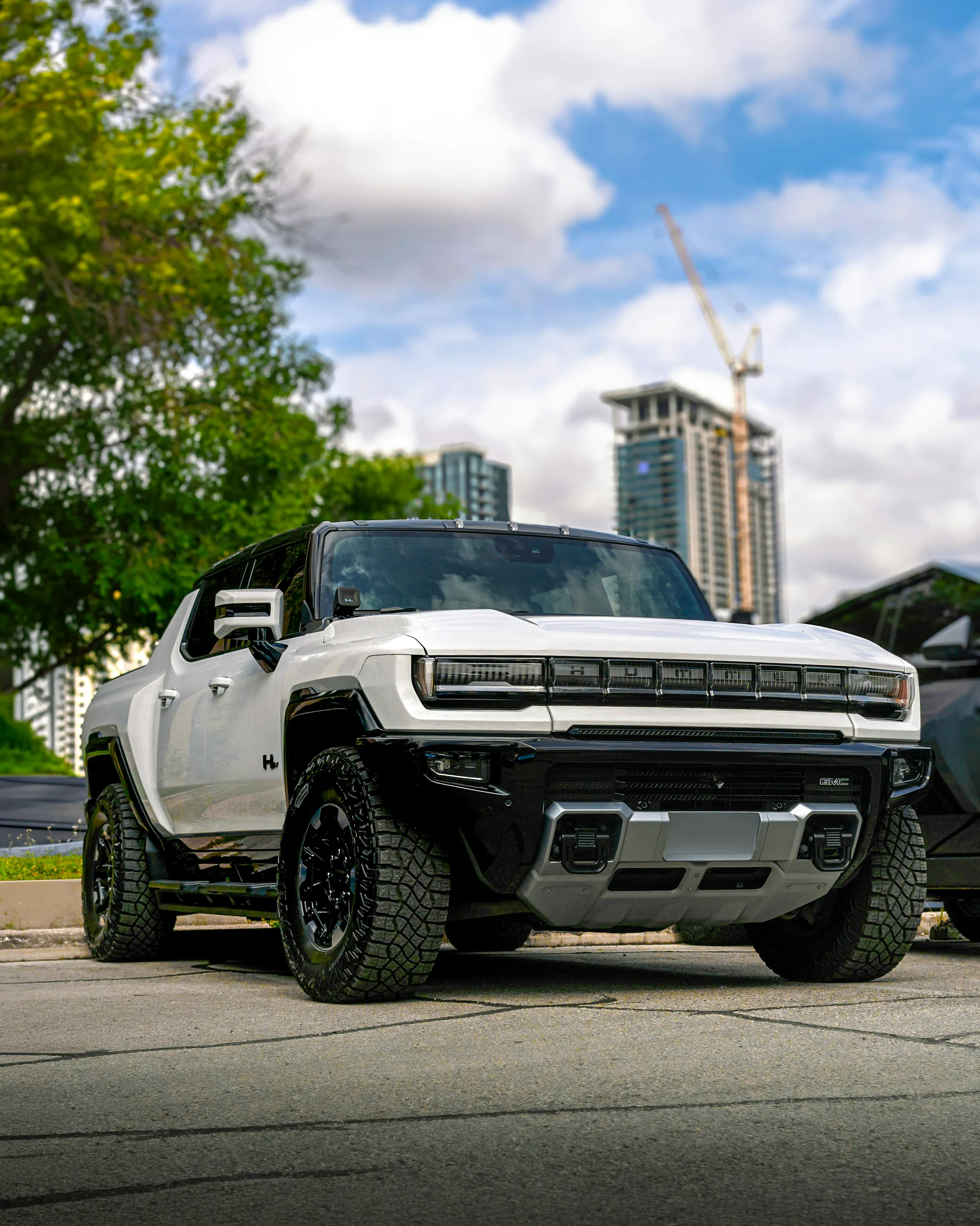 GMC Hummer EV pickup truck parked in an urban environment