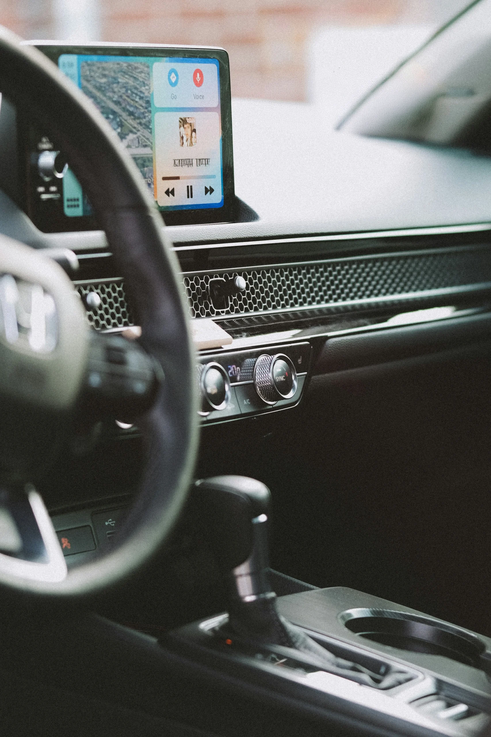 Honda vehicle interior showing infotainment display, climate controls, and center console layout